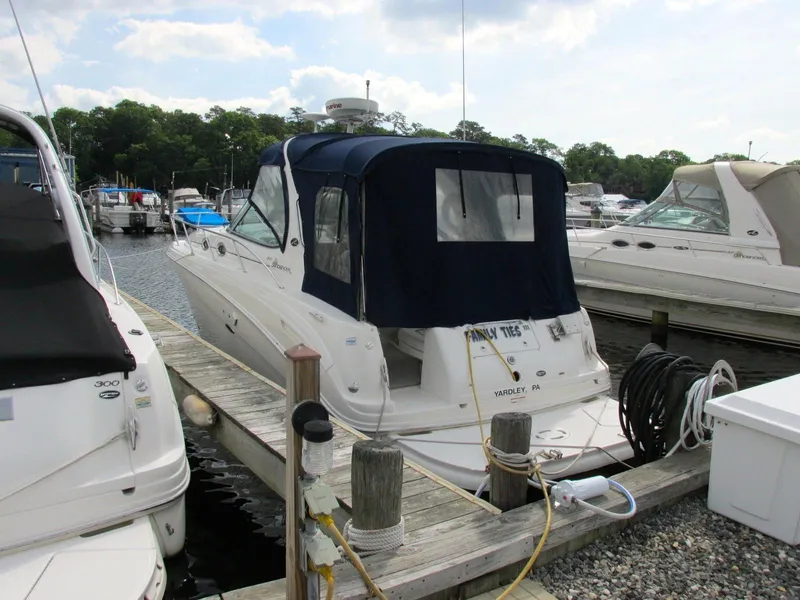 Slide: The Image of 2006 Sea Ray 300 Sundancer docked at marina. - 3
