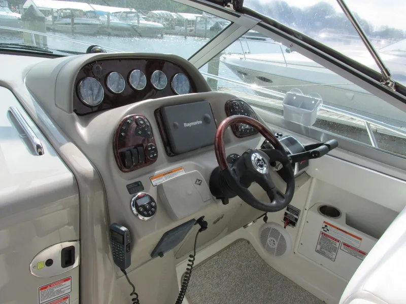Slide: The Image of 2006 Sea Ray 300 Sundancer helm with instruments. - 4