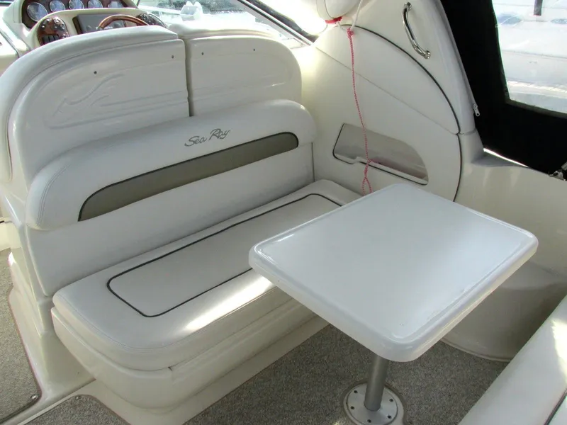 Slide: The Image of Interior of 2006 Sea Ray 300 Sundancer with seating and table. - 6