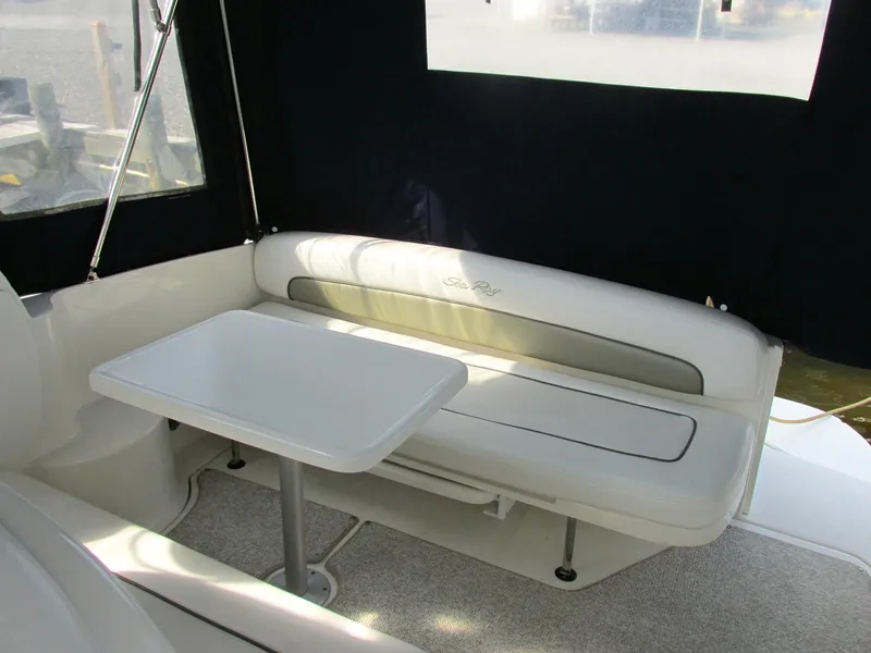 Slide: The Image of Interior of 2006 Sea Ray 300 Sundancer with seating area and table. - 7