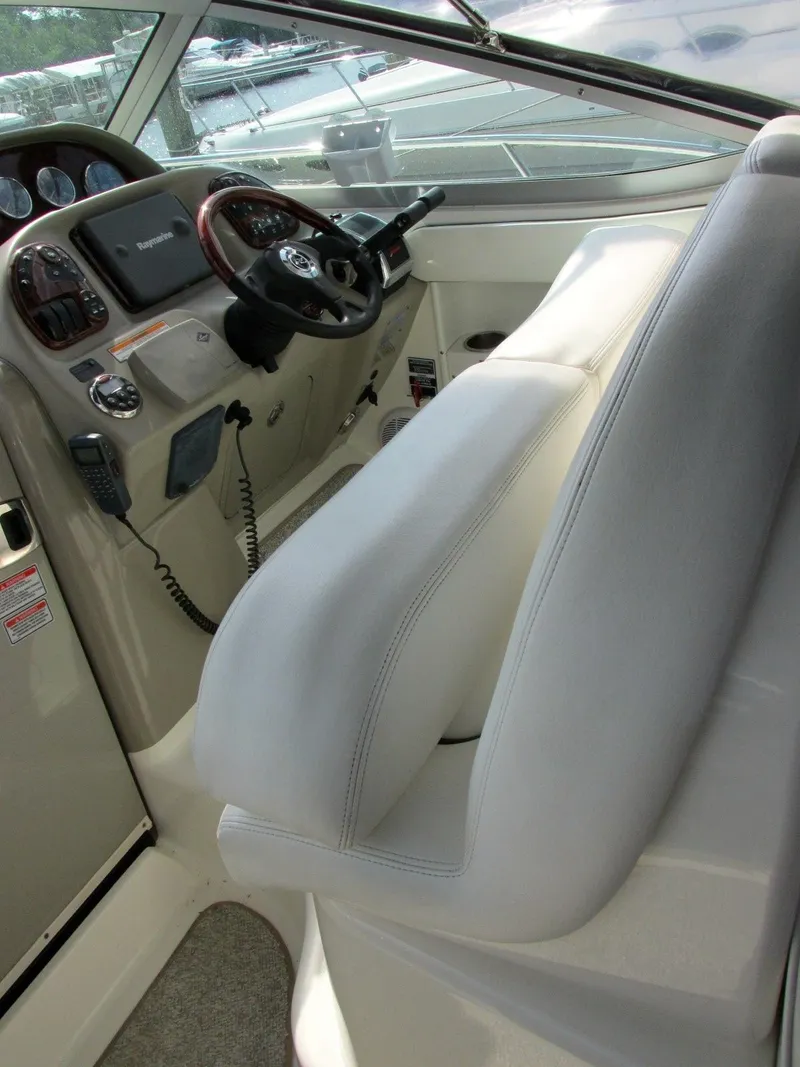 Slide: The Image of Interior of a 2006 Sea Ray 300 Sundancer yacht with helm station. - 8