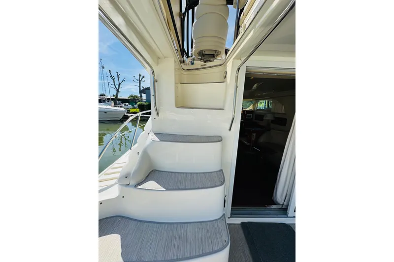 Slide: The Image of Staircase on a 2000 Sea Ray 400 Sedan Bridge yacht, leading to the upper deck. - 21
