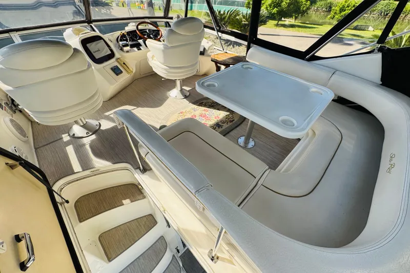 Slide: The Image of Interior of 2000 Sea Ray 400 Sedan Bridge yacht with seating and helm station. - 22