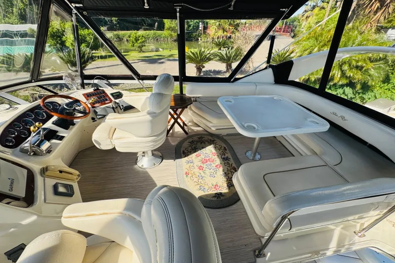 Slide: The Image of Interior of 2000 Sea Ray 400 Sedan Bridge yacht with helm and seating area. - 23