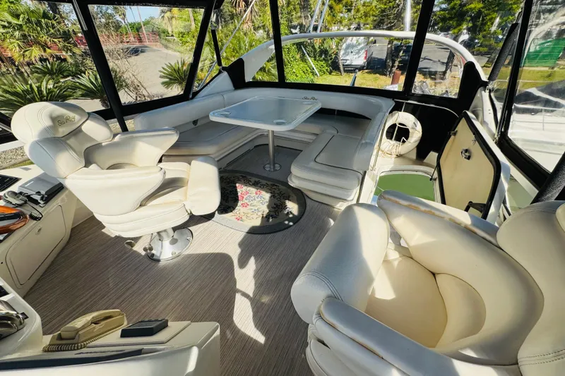 Slide: The Image of Luxurious interior of a 2000 Sea Ray 400 Sedan Bridge yacht with plush seating. - 24