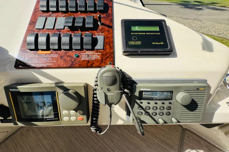 Slide: The Image of Control panel of a 2000 Sea Ray 400 Sedan Bridge with navigation and communication systems. - 31