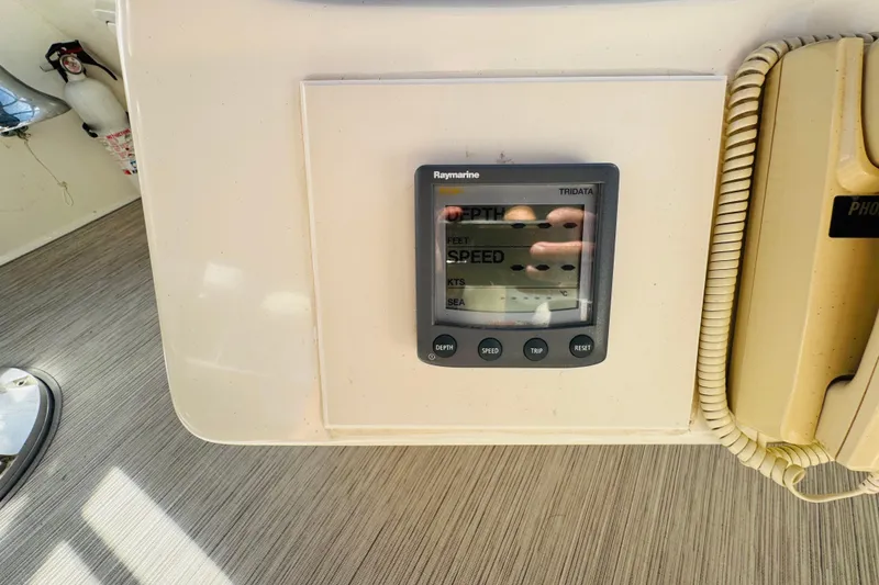 Slide: The Image of Raymarine Tridata display on 2000 Sea Ray 400 Sedan Bridge yacht dashboard. - 34