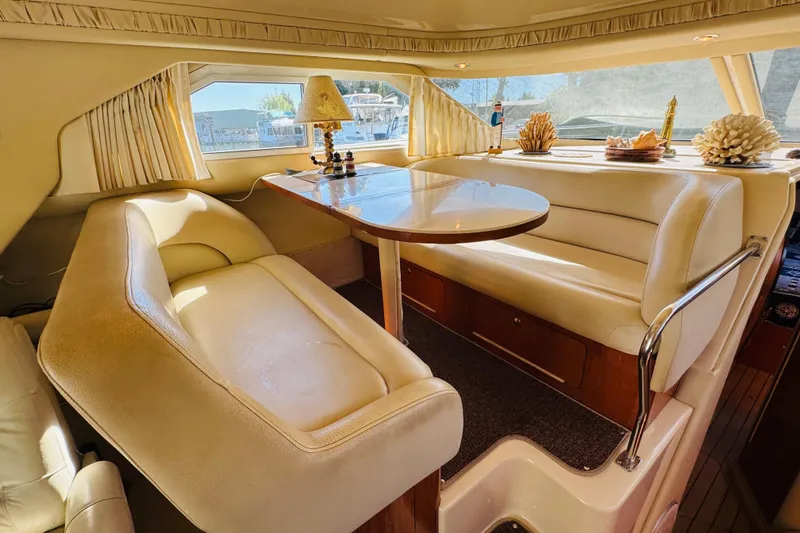 Slide: The Image of Luxurious interior of a 2000 Sea Ray 400 Sedan Bridge yacht with elegant seating and decor. - 40