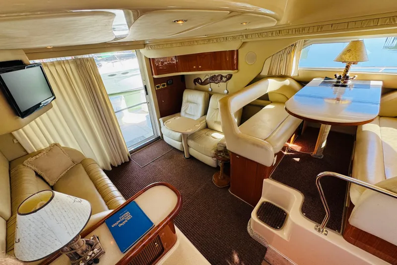 Slide: The Image of Luxurious interior of a 2000 Sea Ray 400 Sedan Bridge yacht with elegant seating and decor. - 44