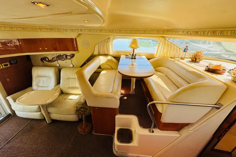 Slide: The Image of Luxurious interior of a 2000 Sea Ray 400 Sedan Bridge yacht with plush seating and elegant decor. - 45
