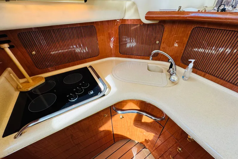 Slide: The Image of Luxurious kitchen area in a 2000 Sea Ray 400 Sedan Bridge yacht. - 49