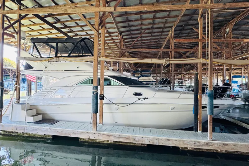 Slide: The Image of 2000 Sea Ray 400 Sedan Bridge yacht docked in a covered marina. - 5