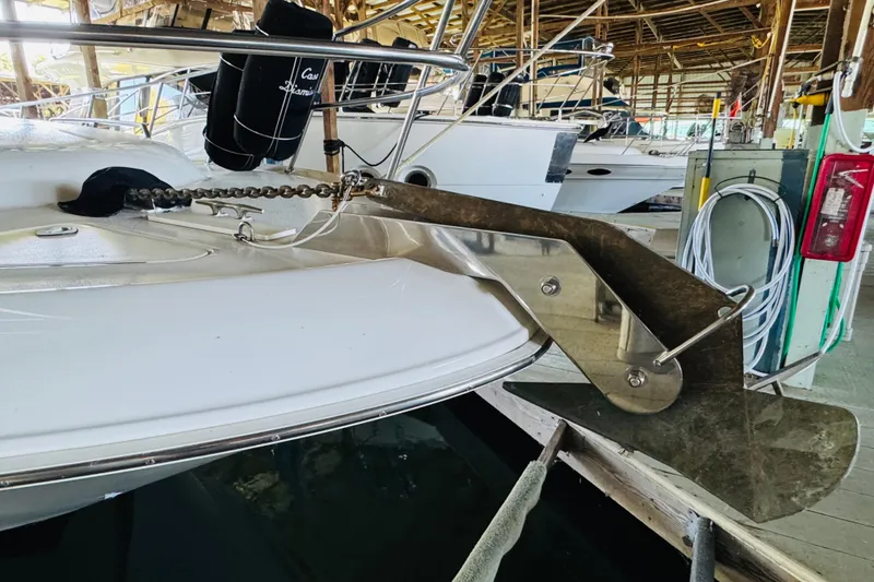 Slide: The Image of 2000 Sea Ray 400 Sedan Bridge yacht with anchor in marina. - 6