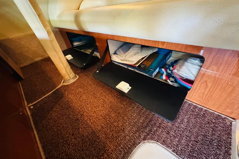 Slide: The Image of Interior storage compartments on a 2000 Sea Ray 400 Sedan Bridge yacht. - 61