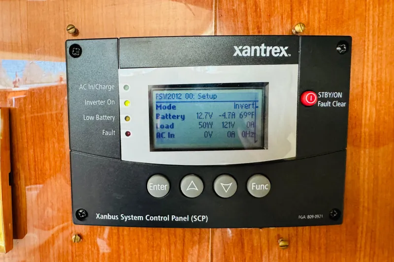 Slide: The Image of Xantrex control panel on 2000 Sea Ray 400 Sedan Bridge, displaying battery and load information. - 65