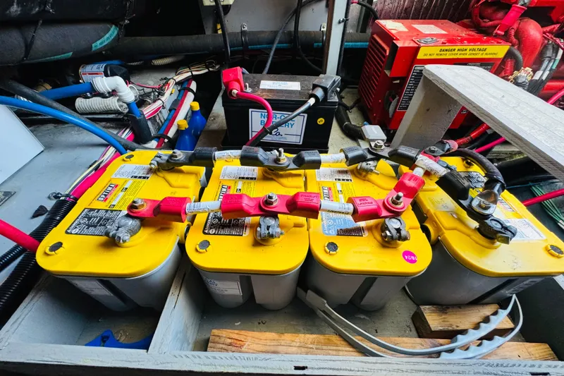 Slide: The Image of Battery setup in a 2000 Sea Ray 400 Sedan Bridge engine room. - 74