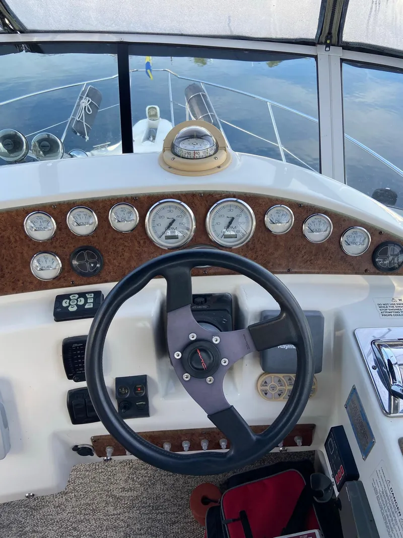 Slide: The Image of 2005 Silverton 330 Sport Bridge in a tranquil harbor. - 10