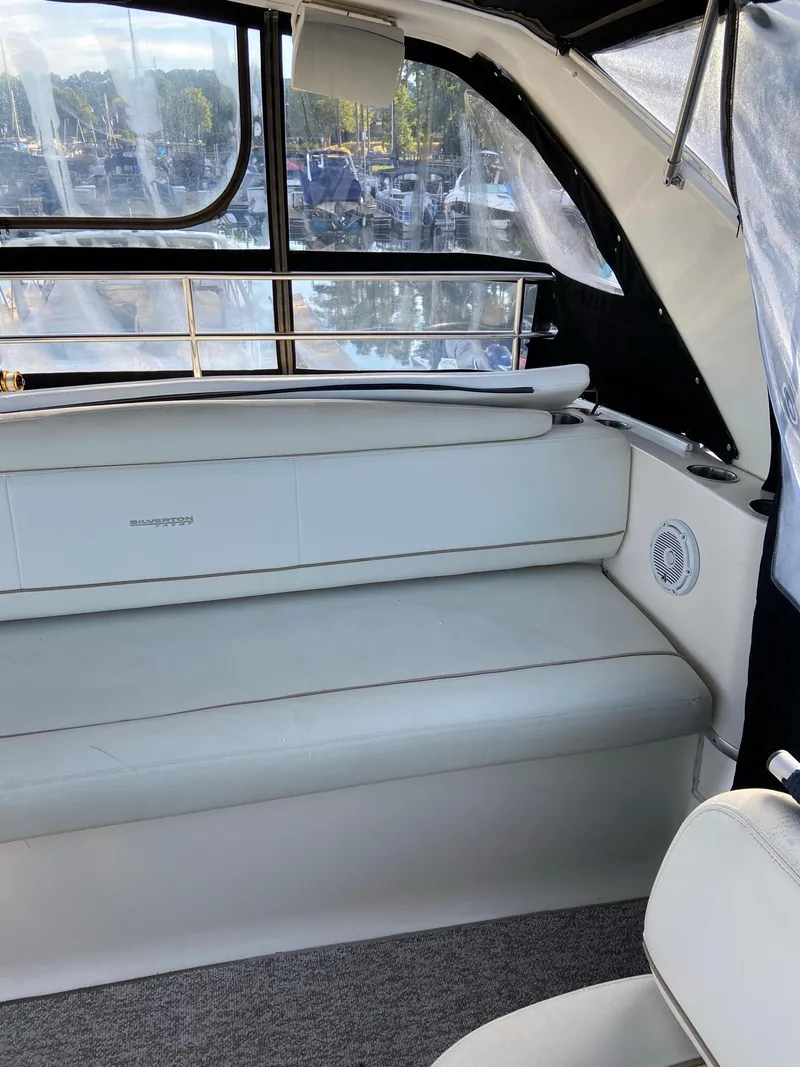 Slide: The Image of 2005 Silverton 330 Sport Bridge helm with controls and gauges. - 12