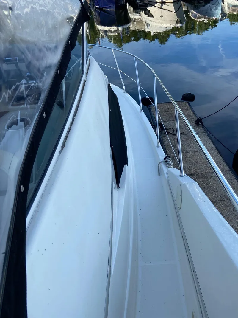 Slide: The Image of 2005 Silverton 330 Sport Bridge boat speakers and deck detail. - 16