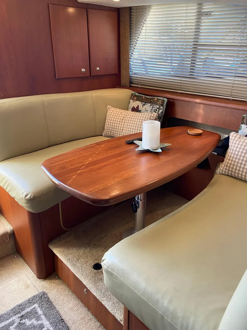 Slide: The Image of 2005 Silverton 330 Sport Bridge yacht docked at a marina with other boats. - 19