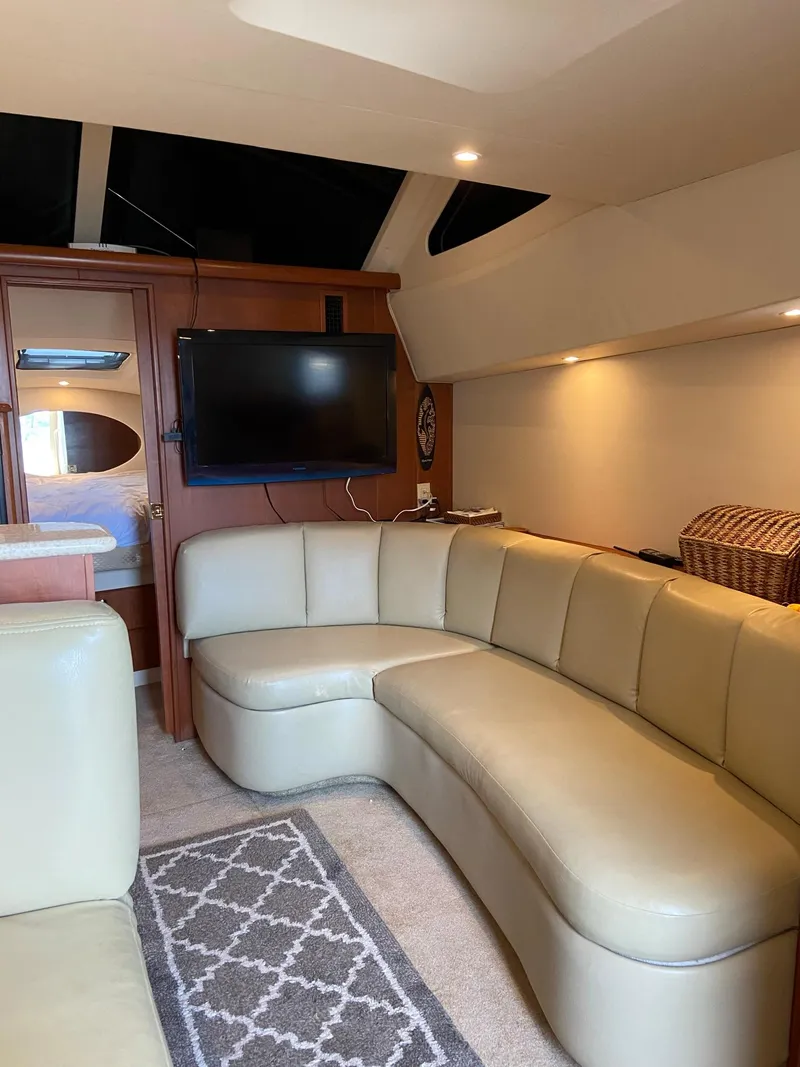 Slide: The Image of Interior of 2005 Silverton 330 Sport Bridge yacht with modern furnishings and natural light. - 26