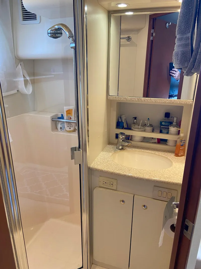 Slide: The Image of Interior of 2005 Silverton 330 Sport Bridge with skylight and TV. - 31