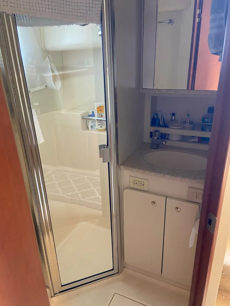 Slide: The Image of 2005 Silverton 330 Sport Bridge bathroom with shower and sink. - 39