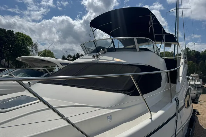 Slide: The Image of 2005 Silverton 330 Sport Bridge docked at Lake Norman marina. - 4