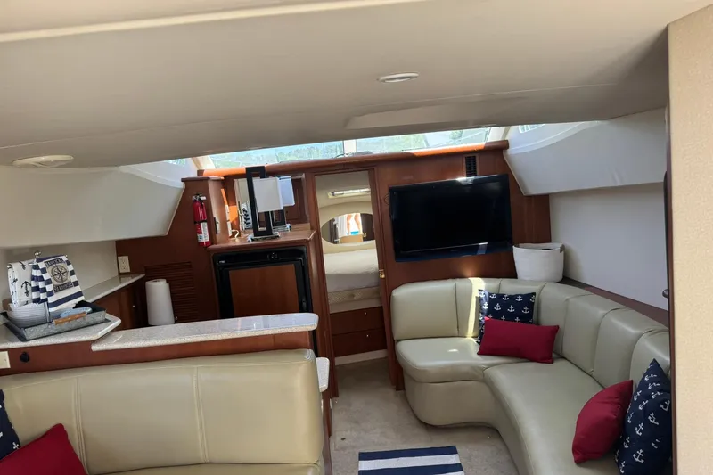 Slide: The Image of Interior of 2005 Silverton 330 Sport Bridge yacht with cozy seating and modern amenities. - 40