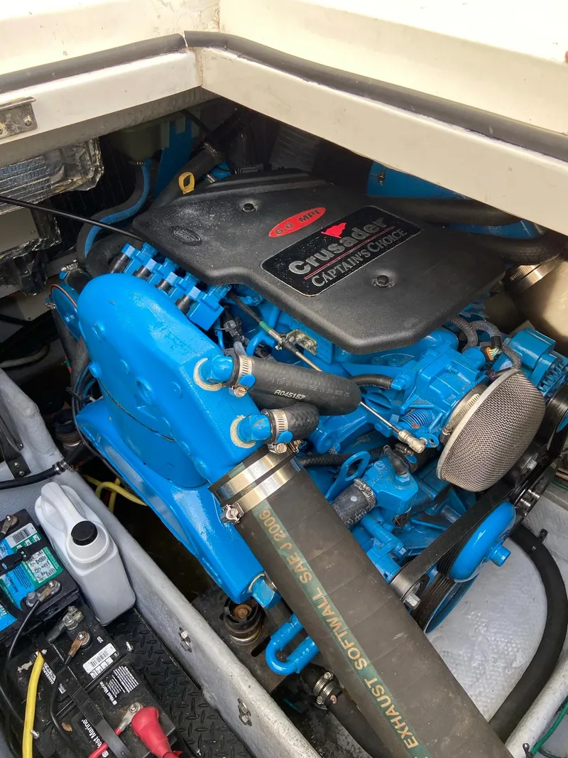 Slide: The Image of Engine compartment of a 2005 Silverton 330 Sport Bridge with blue engine. - 43