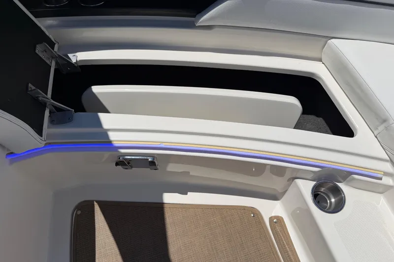 Slide: The Image of Interior detail of a 2015 Sea Ray SLX 350 boat, featuring storage compartments and sleek design. - 20