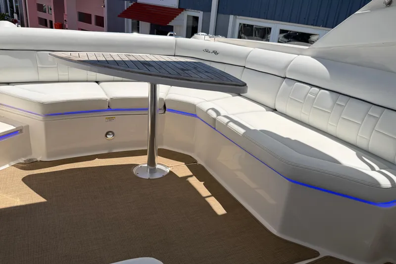 Slide: The Image of Luxurious seating area on a 2015 Sea Ray SLX 350 boat with elegant table. - 24