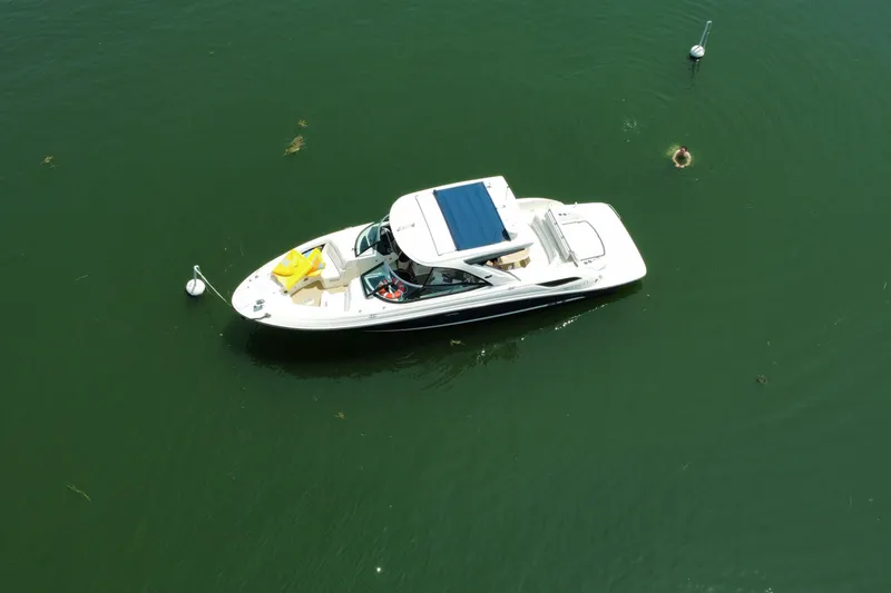 Slide: The Image of Aerial view of 2015 Sea Ray SLX 350 boat anchored on calm green water. - 6