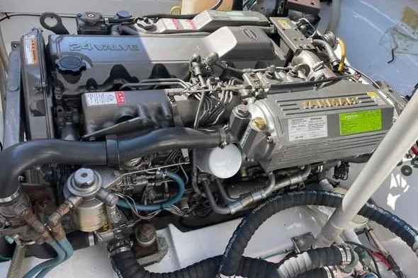 Slide: The Image of Engine of a 2005 Limestone 24' Express Cruiser, showcasing detailed mechanical components. - 19