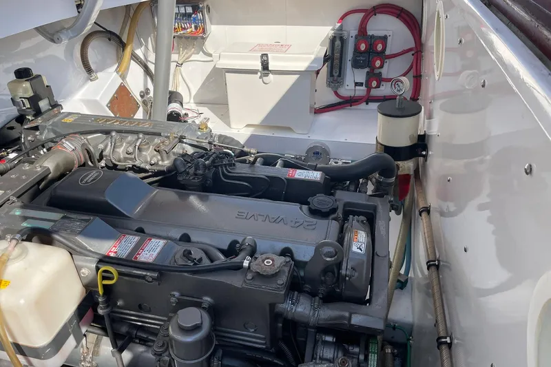 Slide: The Image of Engine compartment of a 2005 Limestone 24' Express Cruiser, showcasing detailed mechanical components. - 20