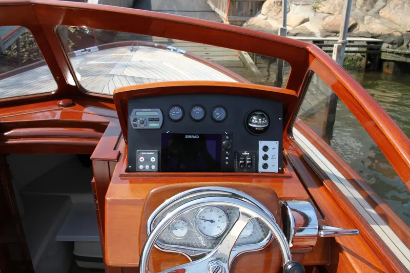 Slide: The Image of 2005 Limestone 24' Express Cruiser with elegant seating and American flag on deck. - 7