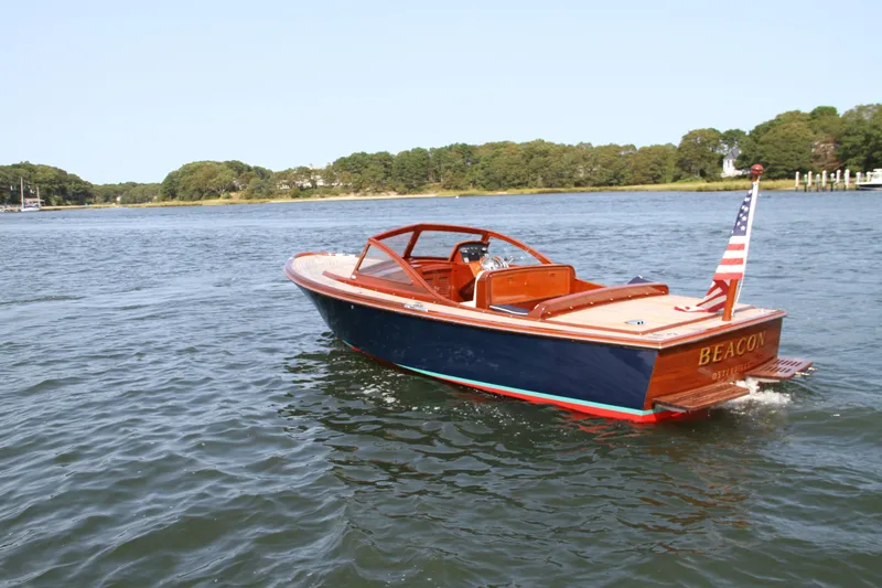 Slide: The Image of 2005 Limestone 24' Express Cruiser dashboard with navigation instruments and steering wheel. - 8