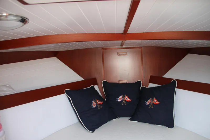 Slide: The Image of Interior cabin of 2005 Limestone 24' Express Cruiser with nautical-themed cushions. - 10