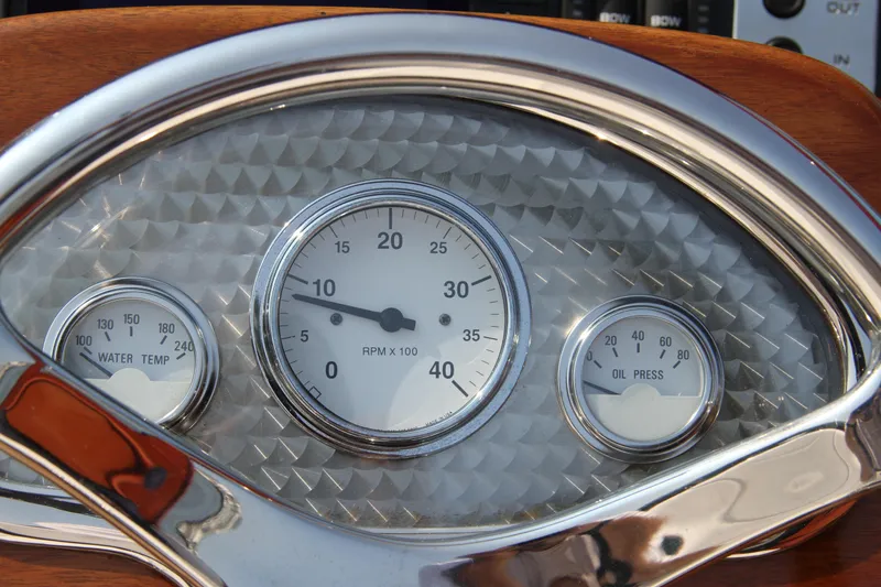 Slide: The Image of Dashboard gauges of a 2005 Limestone 24' Express Cruiser boat. - 11