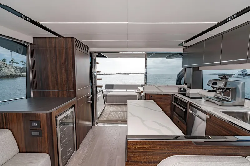 Slide: The Image of Luxurious interior of 2023 Sunseeker 65 Sport Yacht with modern kitchen and ocean view. - 22