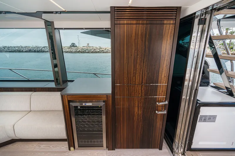 Slide: The Image of Luxurious interior of 2023 Sunseeker 65 Sport Yacht with wood finishes and ocean view. - 27