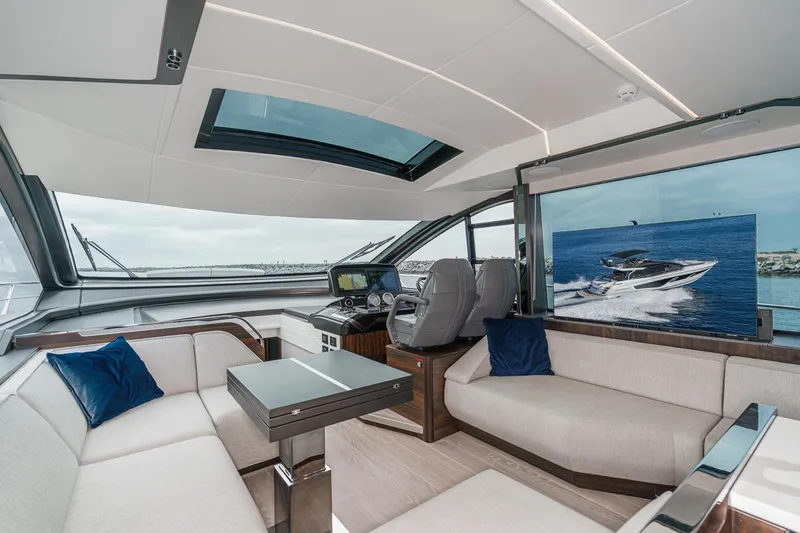 Slide: The Image of Luxurious interior of 2023 Sunseeker 65 Sport Yacht with modern seating and panoramic views. - 31