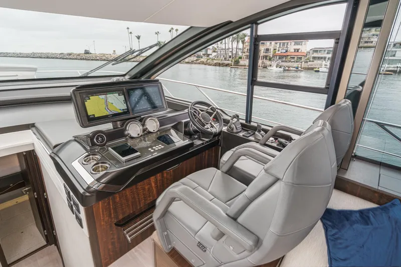 Slide: The Image of Luxurious helm of 2023 Sunseeker 65 Sport Yacht with advanced navigation systems. - 34