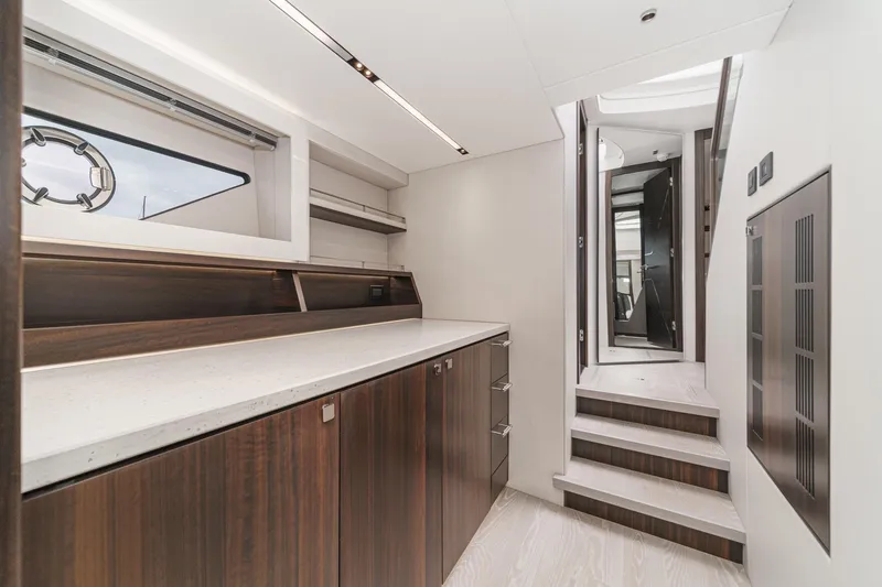 Slide: The Image of Interior of 2023 Sunseeker 65 Sport Yacht, featuring sleek cabinetry and modern design. - 50