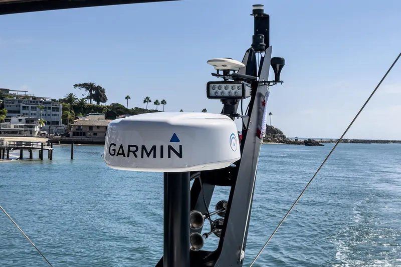 Slide: The Image of Garmin equipment on 2023 Sunseeker 65 Sport Yacht, coastal background. - 53