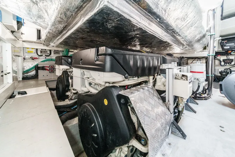 Slide: The Image of Engine room of 2023 Sunseeker 65 Sport Yacht, showcasing advanced mechanical systems. - 55
