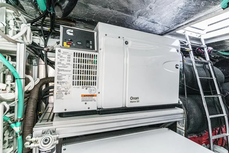 Slide: The Image of Engine room of 2023 Sunseeker 65 Sport Yacht with Onan Marine QD generator. - 59