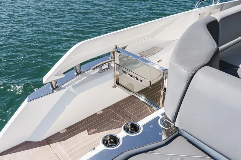 Slide: The Image of 2023 Sunseeker 65 Sport Yacht deck with sleek design and luxurious seating. - 61