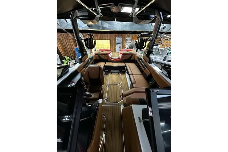 Slide: The Image of 2023 Nautique Super Air Nautique G23 interior with luxurious seating and sleek design. - 4