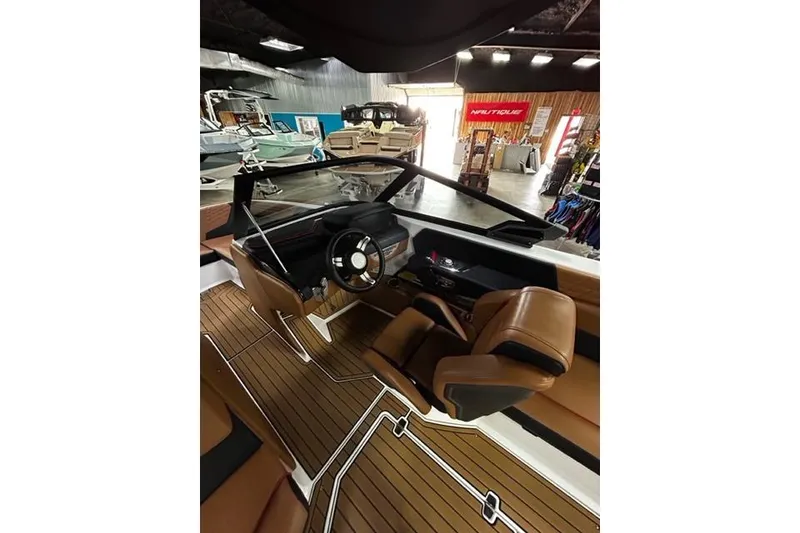 Slide: The Image of Interior of 2023 Nautique Super Air Nautique G23 boat with sleek design and modern controls. - 5